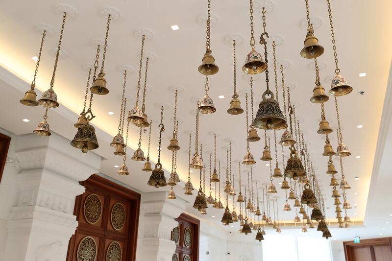 More than 100 brass bells at the entrance of the prayer hall