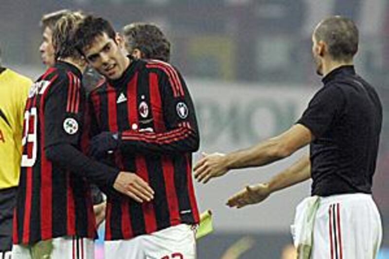 Kaka congratulates teammate Massimo Ambrosini after the Rossoneri's victory over Fiorentina.