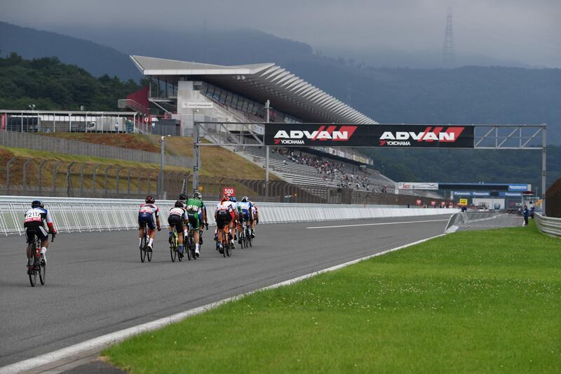 This July 21, 2019 picture shows cyclists riding on the Fuji Speedway race course during the cycling road race Tokyo 2020 Olympic Games test event, at Oyama town in Shizuoka prefecture. (Photo by Toshifumi KITAMURA / AFP)