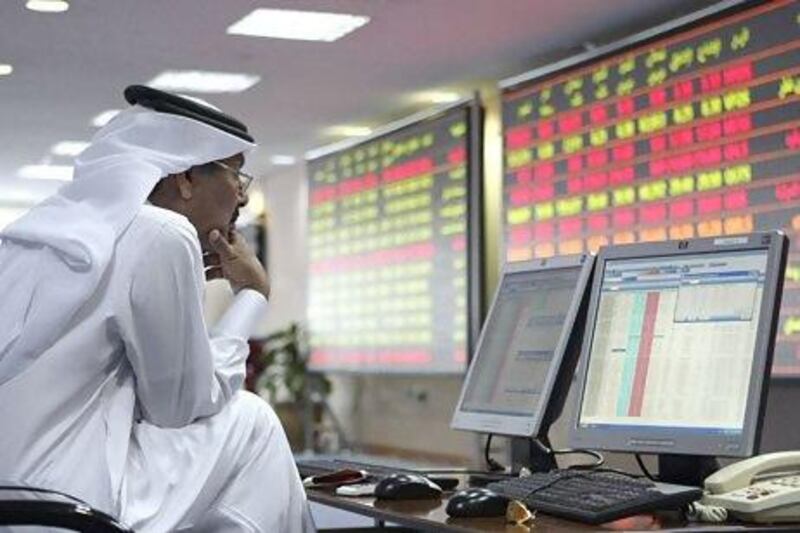 An investor monitors stock market activities at the Doha securities market. Reuters