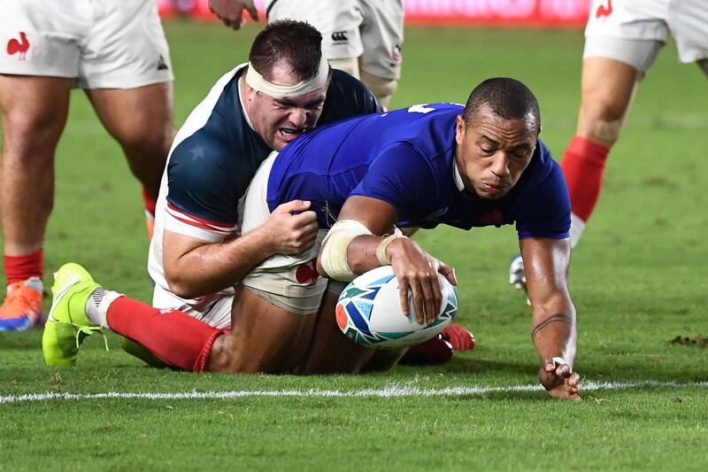 France's centre Gael Fickou (R) scores a try  during the Japan 2019 Rugby World Cup Pool C match between France and the United States at the Fukuoka Hakatanomori Stadium in Fukuoka on October 2, 2019. / AFP / FRANCK FIFE
