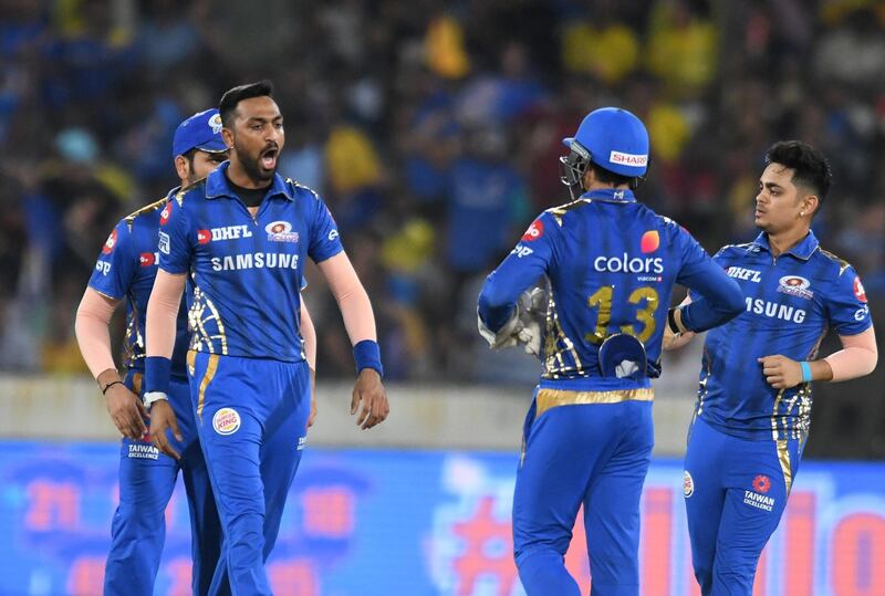 Mumbai Indians cricketer Krunal Pandya (L) celebrates with teammates after taking the wicket of Chennai Super Kings batsman Faf du Plessis during the 2019 Indian Premier League (IPL) Twenty20 final cricket match between Mumbai Indians and Chennai Super Kings at the Rajiv Gandhi International Cricket Stadium in Hyderabad on May 12, 2019. (Photo by NOAH SEELAM / AFP) / ----IMAGE RESTRICTED TO EDITORIAL USE - STRICTLY NO COMMERCIAL USE-----