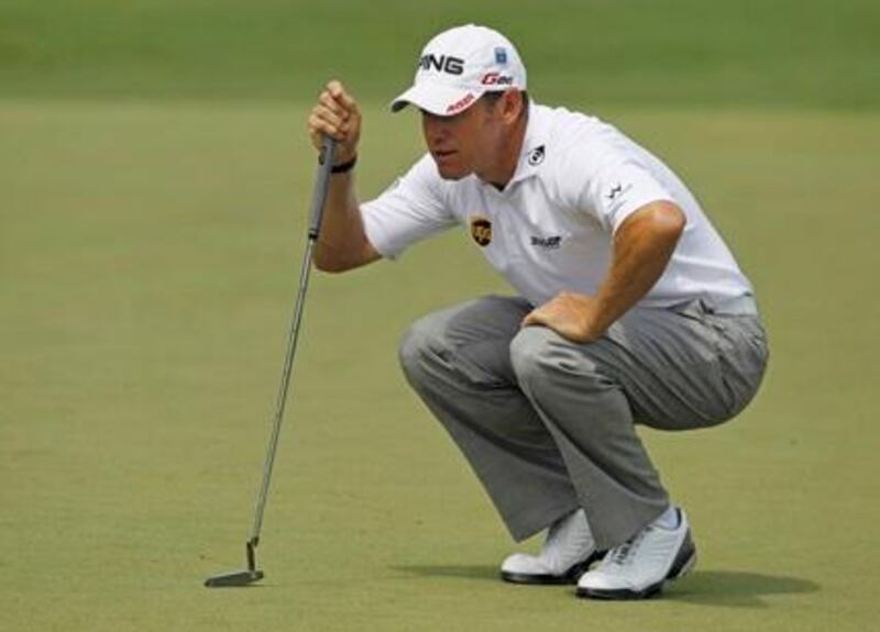 Lee Westwood of England lines up a putt on the second green during first round play in the 2012 Masters Golf Tournament at the Augusta National Golf Club in Augusta, Georgia, April 5, 2012. REUTERS/Mark Blinch (UNITED STATES  - Tags: SPORT GOLF)