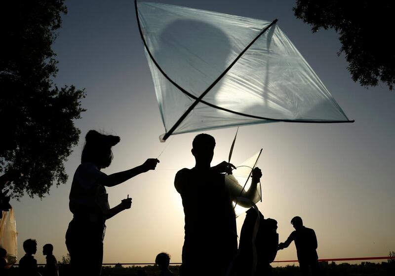 People take part in the Baghdad Kite Festival in Baghdad, Iraq, Saturday, June 5, 2021. (AP Photo/Hadi Mizban)
