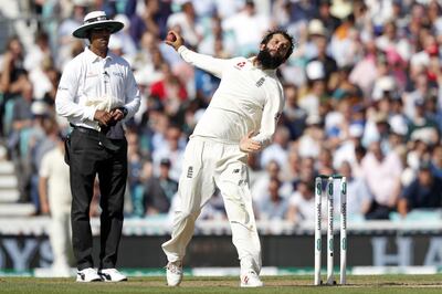 England's Moeen Ali bowls during play on the third day of the fifth Test cricket match between England and India at The Oval in London on September 9, 2018. - India trail England by 40 runs after their first Innings. (Photo by Adrian DENNIS / AFP) / RESTRICTED TO EDITORIAL USE. NO ASSOCIATION WITH DIRECT COMPETITOR OF SPONSOR, PARTNER, OR SUPPLIER OF THE ECB