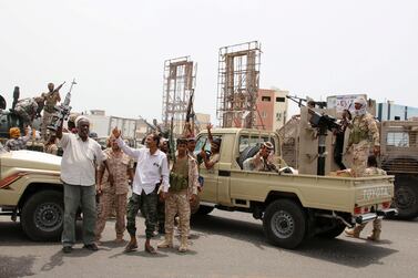 Members of Yemeni Southern Transitional Council shout slogans as they patrol a road during clashes with government forces in Aden, Yemen August 10, 2019. Reuters