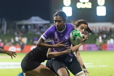 Al Maha’s player running with the ball at the Al Maha vs Al Arabi Gulf Women Rugby game at Dubai 7’s.  Ruel Pableo for The National