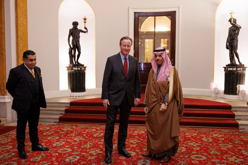 Britain's Foreign Secretary David Cameron with Saudi Foreign Minister Prince Faisal bin Farhan at Lancaster House, London, on November 22. AFP