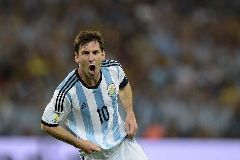 Lionel Messi scores after scoring his team's second goal, the eventual winner, against Bosnia on Sunday night in Argentina's 2-1 win at the 2014 World Cup at the Maracana in Rio de Janeiro, Brazil. Juan Mabromata / AFP / June 15, 2014