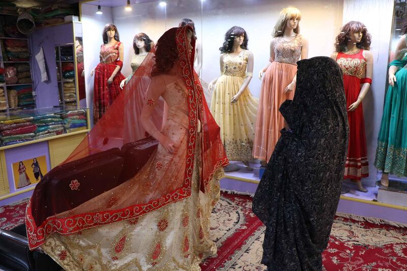 A woman goes for shopping ahead of Eid al-Fitr in Herat, Pakistan.  EPA/JALIL REZAYEE