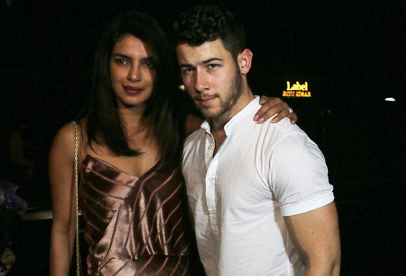 Indian actress Priyanka Chopra (L) and US musician Nick Jonas are pictured after a dinner in Mumbai on November 27, 2018.  Chopra and Jonas are set to be married in a series of ceremonies in Jodhpur starting later this month. / AFP / -
