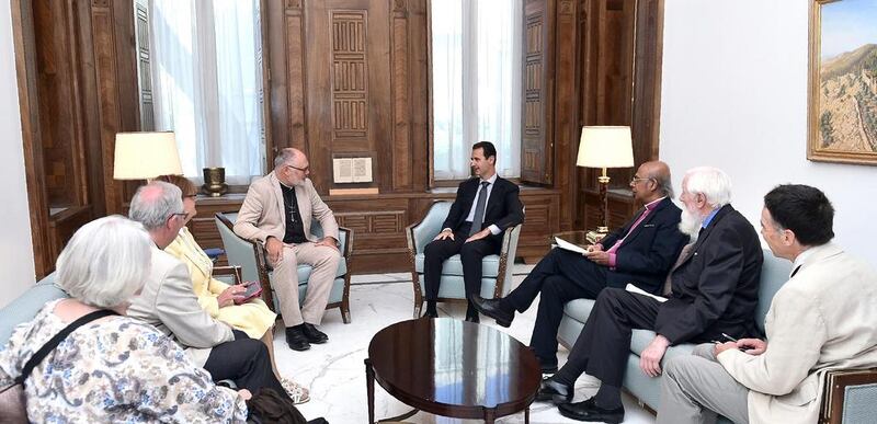 Syrian president Bashar Al Assad met with a visiting British delegation. Louai Beshara / AFP 