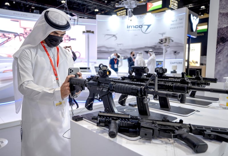 Abu Dhabi, United Arab Emirates, February 22, 2021.  Idex 2021 Day 2.Visitors at the Israeli firearms company, EMTAN.Victor Besa / The NationalSection:  NAReporter:  John Dennehy