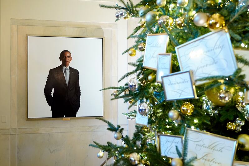 Former president Barack Obama's portrait is on display alongside decorations in the Grand Foyer. AP
