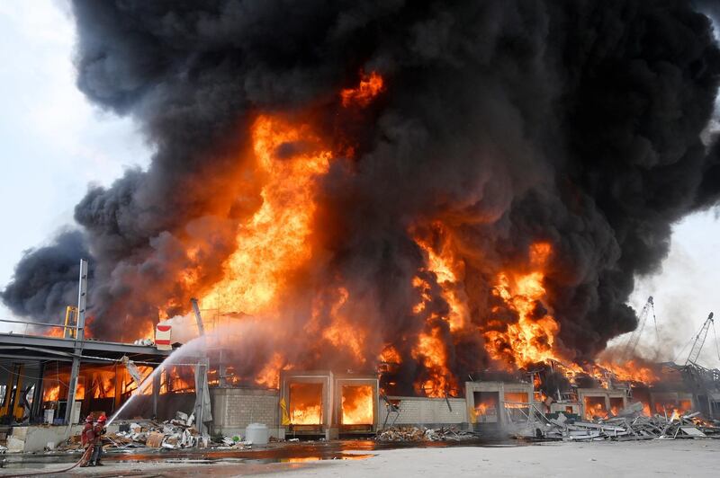 Lebanese firefighters try to extinguish a fire at the Beirut port. EPA