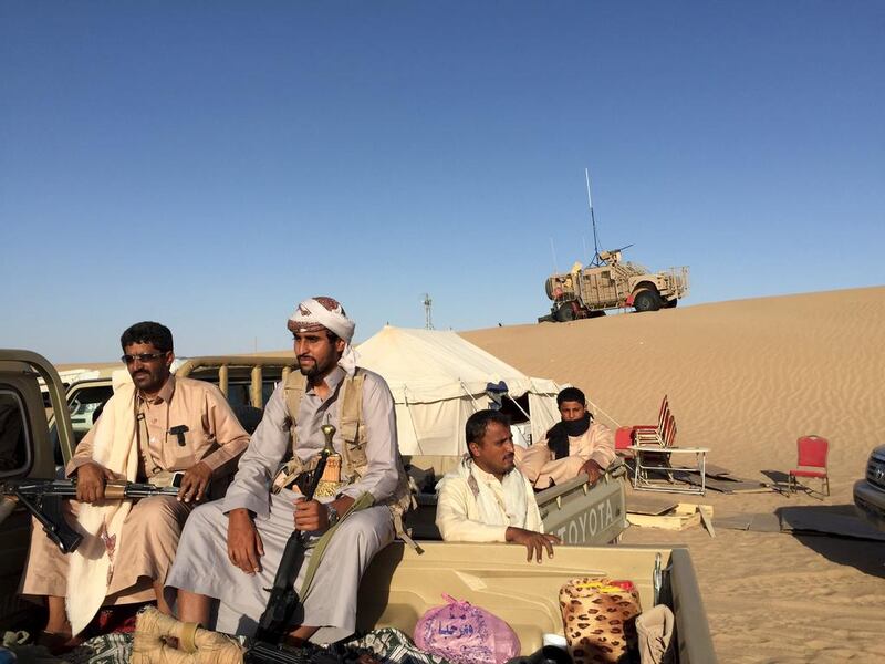 Armed Yemeni tribesmen sit in the back of a pickup truck in Marib, where they are fighting alongside Yemeni troops and soldiers from the Gulf against Houthi rebels. Noah Browning / Reuters