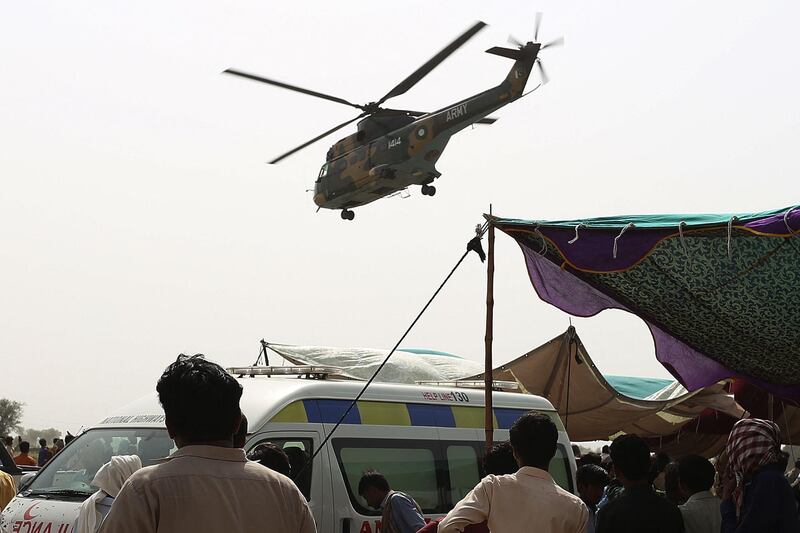 An army helicopter carrying injured passengers takes off from the accident site. AFP