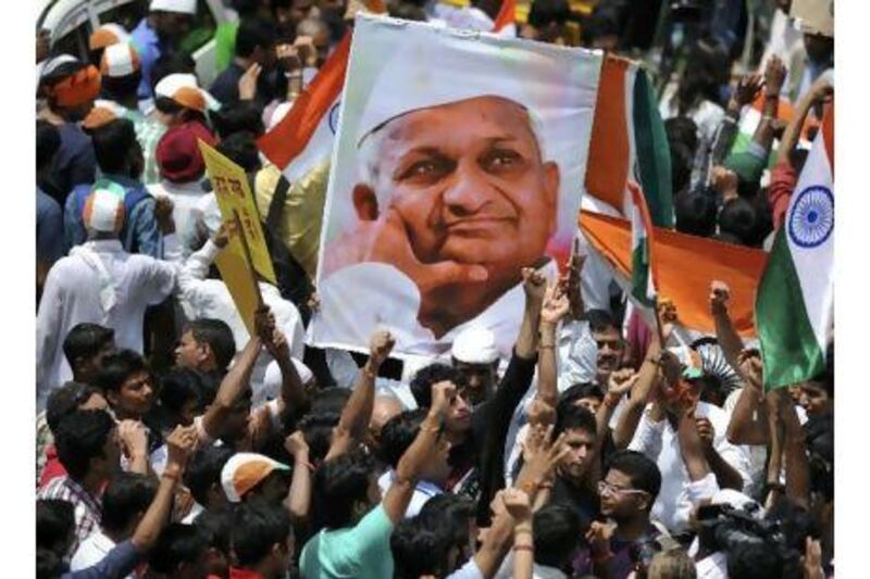 Supporters of Indian social activist Anna Hazare rally outside Tihar Jail in New Delhi on Thursday. A reader urges the government of India to heed to people's voice and stamp out widespread corruption. AFP Photo/Sajjad Hussain