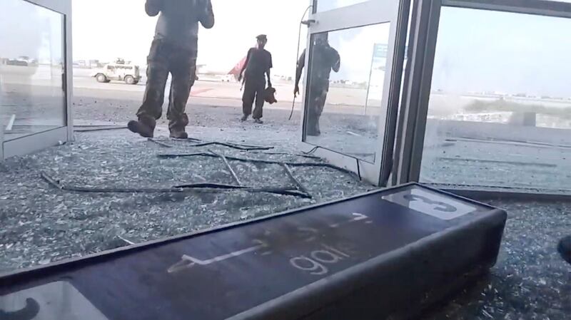 Glass and debris covers the damaged portion of the airport in Yemenâ€™s southern city of Aden after an explosion, Wednesday, Dec. 30, 2020. The blast struck the airport building shortly after a plane carrying the newly formed Cabinet landed on Wednesday. No one on the government plane was hurt.  (AP Photo)