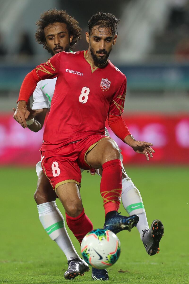 Al Hilal's defender Yasser al-Shahrani (back) with the Saudi team during the Arabian Gulf Cup final against Bahrain.