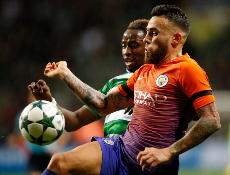 Manchester City's Nicolas Otamendi, right, and Celtic's Moussa Dembele vie for the ball during the Uefa Champions League Group C match at Celtic Park, Glasgow, Scotland, on Wednesday September 28, 2016. (Jane Barlow / PA