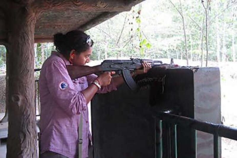 The writer tries firing an AK47 during a visit to the Cu Chi tunnels outside Ho Chi Minh City.