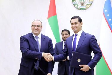 Mohamed Jameel Al Ramahi, chief executive of Masdar, and Sardor Umurzakov, minister of investments and foreign trade of Uzbekistan after signing the new deal. Supplied by Masdar