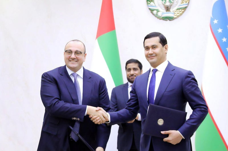 Mohamed Jameel Al Ramahi, chief executive of Masdar, and Sardor Umurzakov, minister of investments and foreign trade of Uzbekistan after signing the new deal. Supplied by Masdar