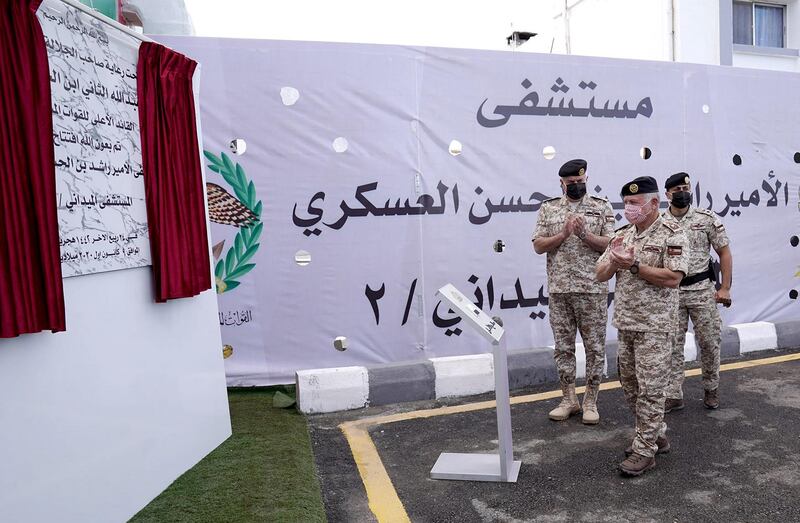 A handout picture released by the Jordanian Royal Palace on December 9, 2020 shows Jordan's King Abdullah II attending the inauguration of a military field hospital for Covid-19 patients in Irbid Governorate. - Jordan has opened the first of three field hospitals for Covid-19 patients in Zarqa, northeast of the capital, on December 8 as a sharp rise in cases has overburdened health facilities. The three hospitals together will have more than 1,000 beds, including 180 for intensive care. (Photo by Yousef ALLAN / Jordanian Royal Palace / AFP) / RESTRICTED TO EDITORIAL USE - MANDATORY CREDIT "AFP PHOTO / JORDANIAN ROYAL PALACE / YOUSEF ALLAN" - NO MARKETING NO ADVERTISING CAMPAIGNS - DISTRIBUTED AS A SERVICE TO CLIENTS