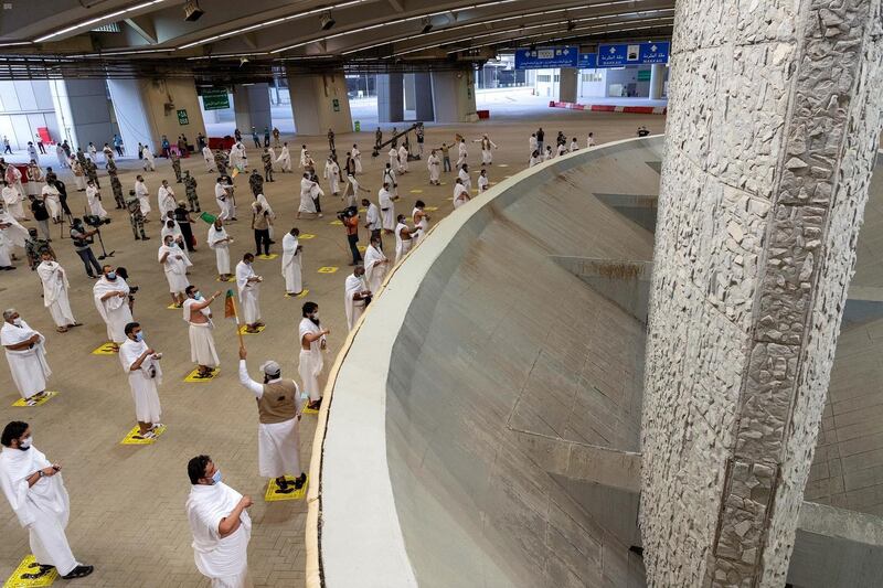 A handout picture provided by Saudi Press Agency (SPA), on July 31, 2020, shows Muslim worshippers throwing pebbles as part of the symbolic al-A'qabah (stoning of the devil ritual) at the Jamarat Bridge during the Hajj pilgrimage in Mina, near Saudi Arabia's holy city of Mecca Muslim pilgrims converged today on Saudi Arabia's Mount Arafat for the climax of this year's hajj, the smallest in modern times and a sharp contrast to the massive crowds of previous years. - === RESTRICTED TO EDITORIAL USE - MANDATORY CREDIT "AFP PHOTO / HO / SPA" - NO MARKETING NO ADVERTISING CAMPAIGNS - DISTRIBUTED AS A SERVICE TO CLIENTS ===
 / AFP / SPA / - / === RESTRICTED TO EDITORIAL USE - MANDATORY CREDIT "AFP PHOTO / HO / SPA" - NO MARKETING NO ADVERTISING CAMPAIGNS - DISTRIBUTED AS A SERVICE TO CLIENTS ===
