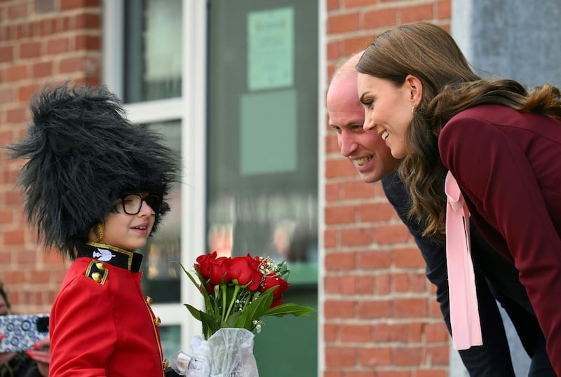 The Princess of Wales receives flowers from eight-year-old Henry Dynov-Teixeira as she departs Greentown Labs. EPA