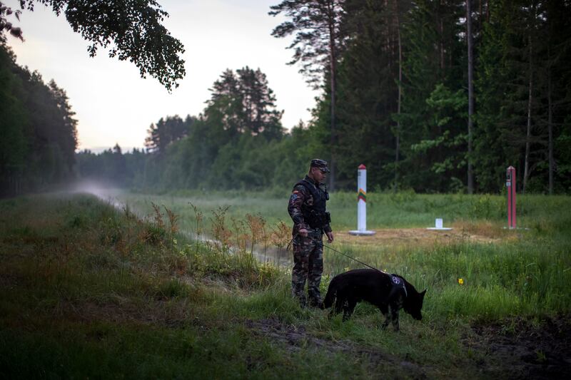 A member of Lithuania's State Border Guard Service patrols the border with Belarus which has become a flashpoint amid tensions between Brussels and Minsk. AP