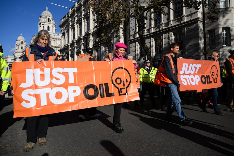 Members of Just Stop Oil block traffic in Whitehall. Getty Images