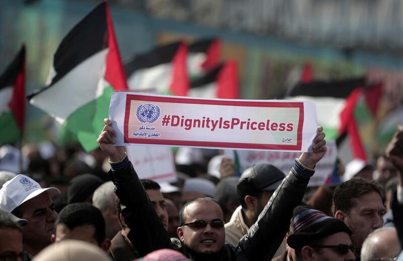 Thousands of employees of the U.N agency for Palestinian refugees demonstrate in support of their organization following U.S. funding cuts in Gaza City, Monday, Jan. 29, 2018. Earlier this month, the Trump administration slashed $60 million of a planned $125 million funding installment for 2018. Washington wants the Palestinian Authority to return to the negotiating table with Israel in exchange for aid resumption. (AP Photo/ Khalil Hamra)