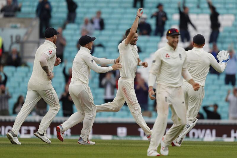 England's James Anderson (C) celebrates after taking the wicket of India's Mohammed Shami on the final day of the fifth Test cricket match between England and India at The Oval in London on September 11, 2018. - The match ended when James Anderson became the most successful fast bowler in Test history when he bowled Mohammed Shami for his 564th Test wicket, breaking the record he had shared with Australia's Glenn McGrath. (Photo by Adrian DENNIS / AFP) / RESTRICTED TO EDITORIAL USE. NO ASSOCIATION WITH DIRECT COMPETITOR OF SPONSOR, PARTNER, OR SUPPLIER OF THE ECB