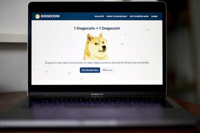 The Dogecoin website on a laptop computer arranged in the Brooklyn borough of New York, U.S., on Friday, May 7, 2021. Dogecoin, a cryptocurrency conceived as a joke but now the world's fifth-most valuable, plunged from an all-time high after its most famous cheerleader, Elon Musk, jokingly called it "a hustle" on late-night TV. Photographer: Gabby Jones/Bloomberg