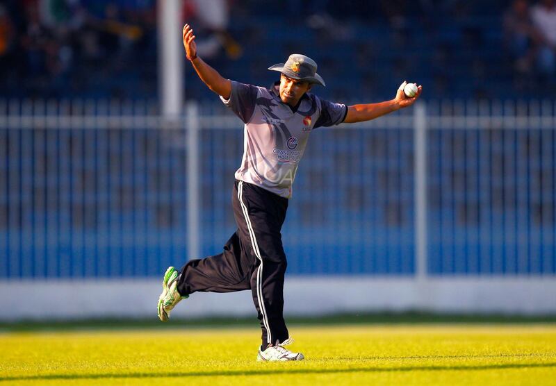 Khurram Khan of the UAE celebrates catching a shot from Gyanendra Malla of Nepal during the ACC Trophy Final between the UAE and Nepal at Sharjah Cricket Stadium, Sharjah on the 12th October 2012.  Credit: Jake Badger/The National


