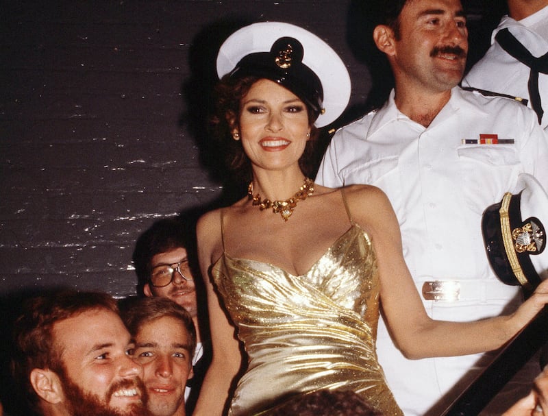 Welch with sailors from the aircraft carrier USS Saipan and a few marines in July 1982 in New York. AP