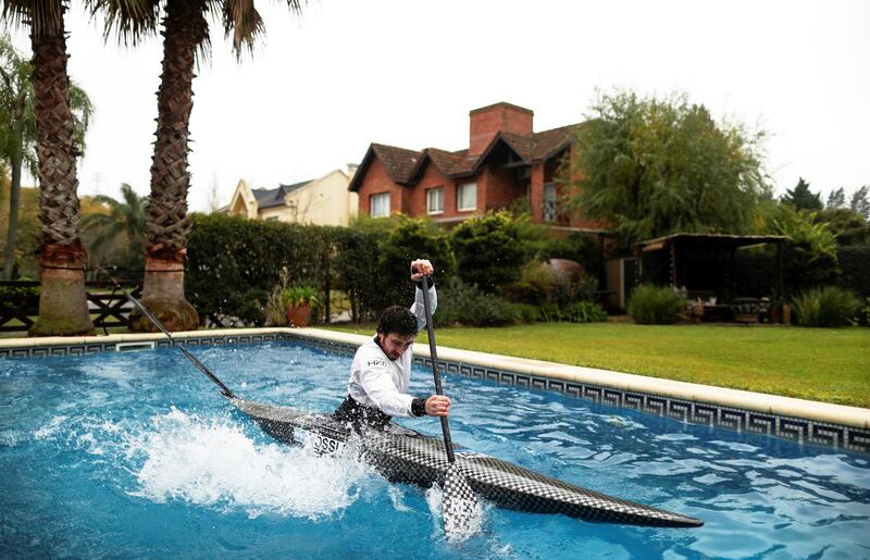 Argentine canoeist Sebastian Rossi trains for the Tokyo 2020 Olympic Games in his girlfriend's pool in Buenos Aires. Reuters