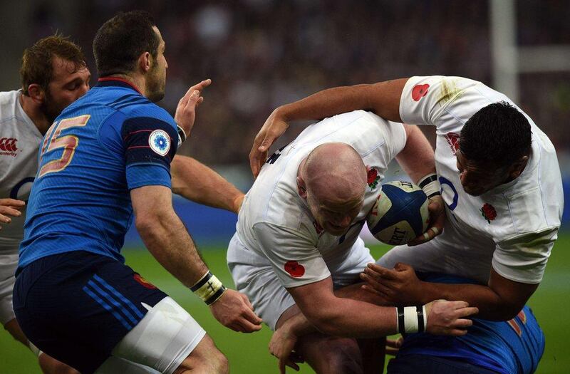 England’s prop Dan Cole (C) runs and scores a try  during the Six Nations international rugby union match between France and England at the Stade de France in Saint-Denis, north of Paris, on March 19, 2016. AFP PHOTO / FRANCK FIFE