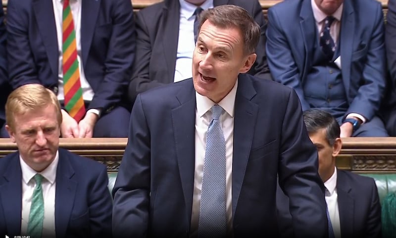 Mr Hunt delivering his budget speech to the House of Commons. PA