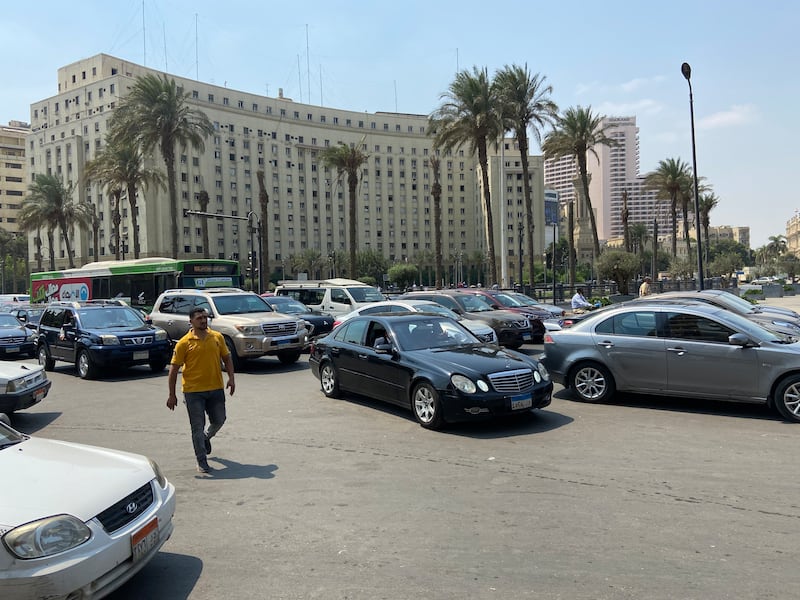 A man walks near traffic in front of the Mogamaa building in Cairo city centre's Tahrir Square. All photos: Nada El Sawy / The National