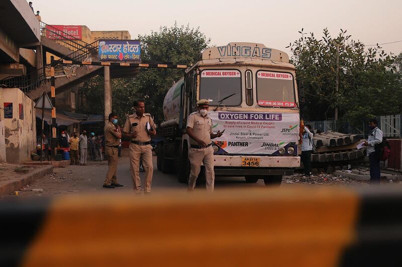 Medical oxygen tankers are delivered via the ‘Oxygen Express’ train to a Delhi railway station. Bloomberg