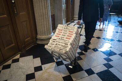 Pizza wheeled in to The Lyndon Baines Johnson Room off the Senate Chamber before final passage of the Inflation Reduction Act at the US Capitol, on August 7 in Washington. The Senate worked overnight as they moved towards the passage of the deal. Getty Images / AFP
