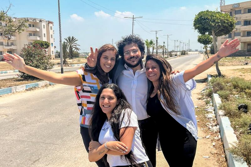 Patrick Zaki celebrates his release with his family on Thursday outside the Dakahlia security headquarters in Mansoura. AP