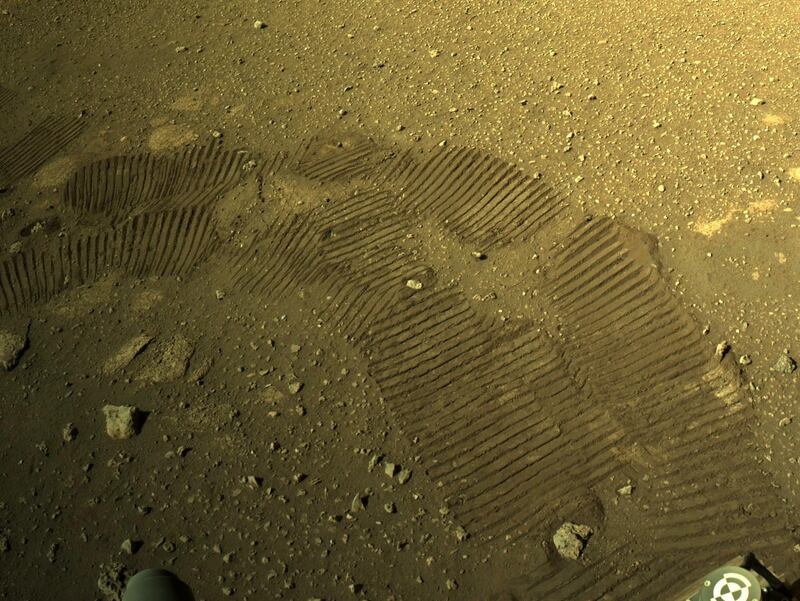 epa09054568 A handout photo made available by NASA shows tyre marks left by NASA's Perseverance Mars rover, 05 March 2021. The rover moved for the first time since landing on Mars on February, 18. Perseverance's main mission on Mars is astrobiology and the search for signs of ancient microbial life, according to NASA.  EPA/NASA/JPL-Caltech HANDOUT  HANDOUT EDITORIAL USE ONLY/NO SALES HANDOUT EDITORIAL USE ONLY/NO SALES