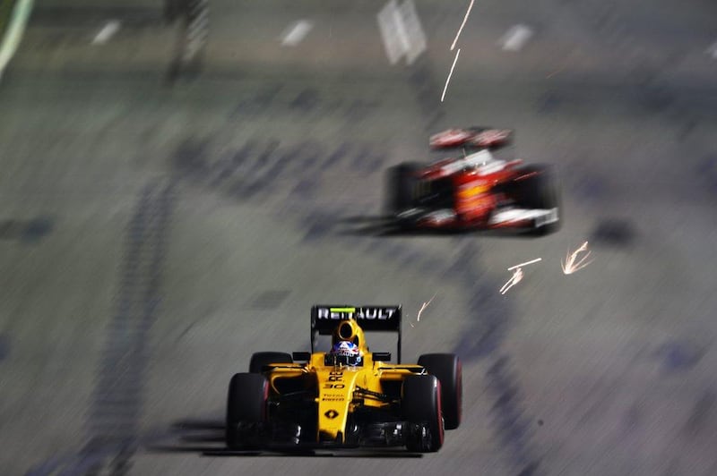 Jolyon Palmer of Renault leads Sebastian Vettel of Ferrari during the Formula One Singapore Grand Prix. Clive Mason / Getty Images