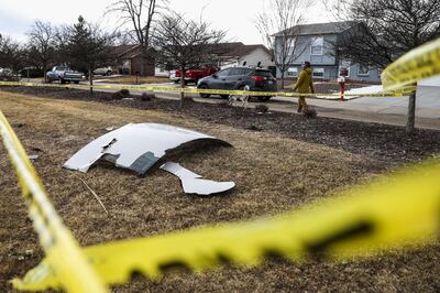 BROOMFIELD, CO - FEBRUARY 20: Pieces of an airplane engine from Flight 328 sit scattered in a neighborhood on February 20, 2021 in Broomfield, Colorado. An engine on the Boeing 777 exploded after takeoff from Denver prompting the flight to return to Denver International Airport where it landed safely.   Michael Ciaglo/Getty Images/AFP
== FOR NEWSPAPERS, INTERNET, TELCOS & TELEVISION USE ONLY ==

