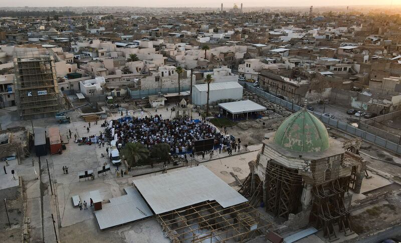 Worshippers gather to pray in the courtyard of the Al Nouri Mosque in Mosul, northern Iraq, during the Eid Al Adha holiday.  AFP