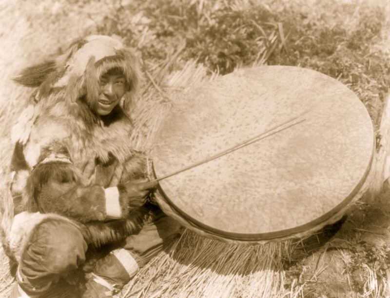 An Inuit from Alaska with a traditional drum. Alaskan Inuit are similar culturally and musically to those from Greenland and Canada. Buyenlarge / Getty Images.